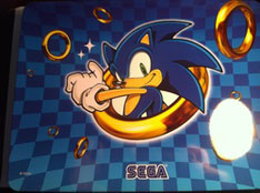 Sonic themed metal tin with rings