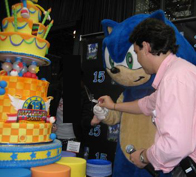 Mascot suit cake celebration