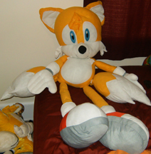 Kelly Toy largest Tails plush sits